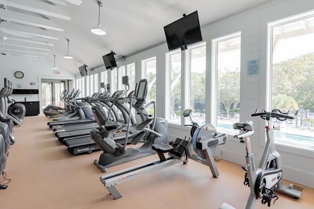 gym featuring vaulted ceiling