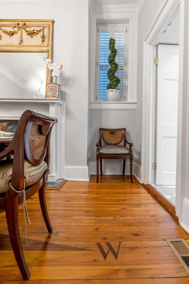 living area with hardwood / wood-style floors