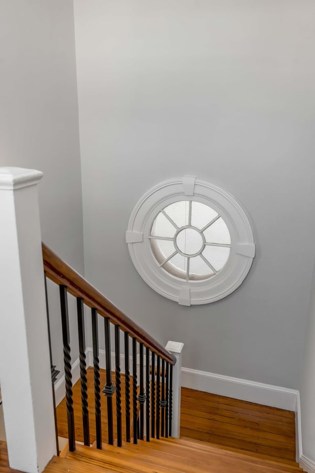 stairway with wood-type flooring