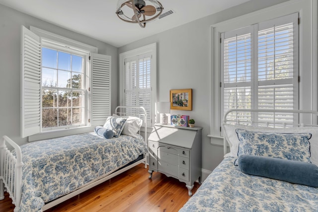 bedroom with wood-type flooring