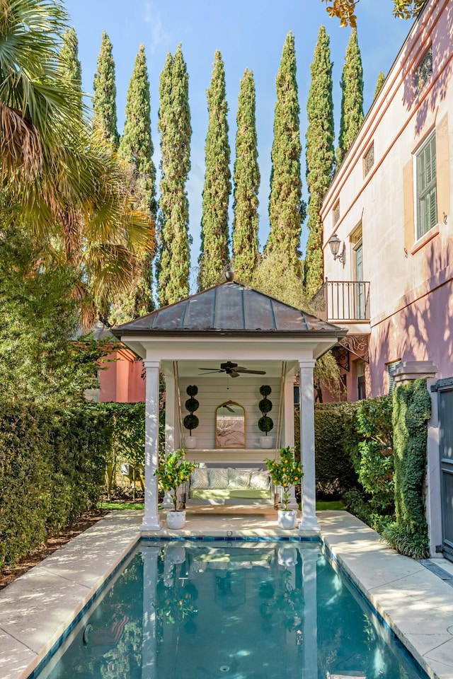 view of swimming pool featuring a gazebo, an outdoor structure, and a patio