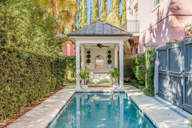 view of swimming pool featuring ceiling fan