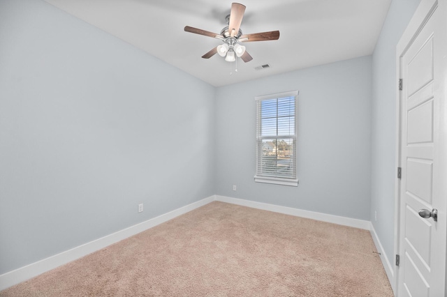 spare room with carpet and ceiling fan