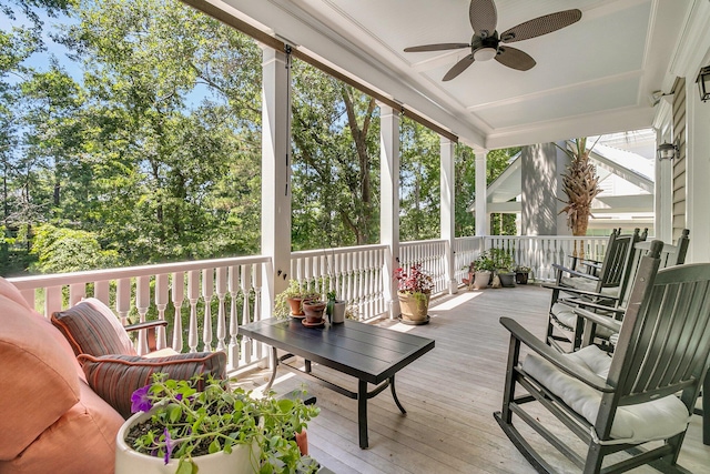 sunroom featuring ceiling fan