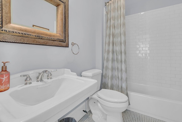 full bathroom featuring sink, tile flooring, shower / bath combination with curtain, and toilet