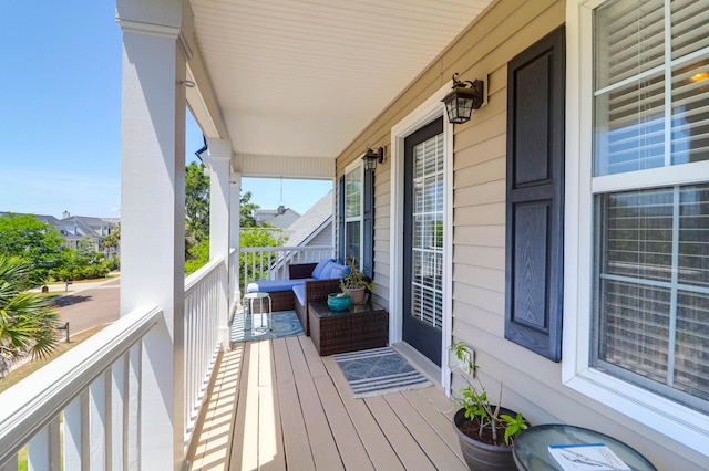 wooden terrace with a porch