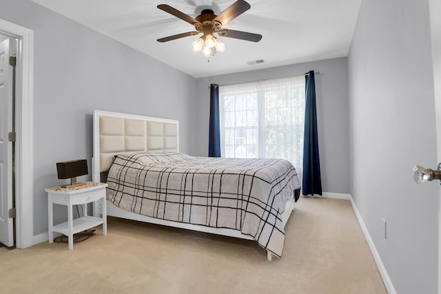 bedroom with baseboards, carpet, and ceiling fan