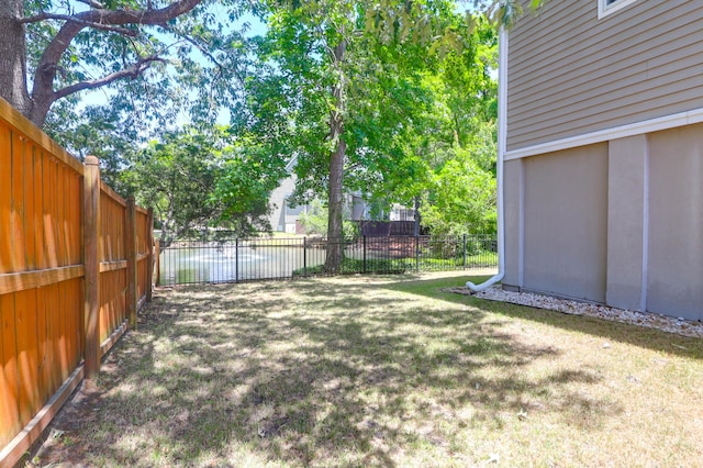 view of yard with a fenced backyard