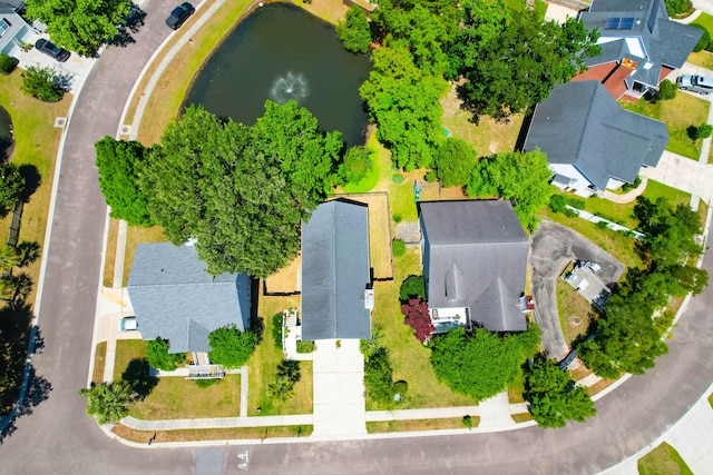 drone / aerial view with a water view and a residential view