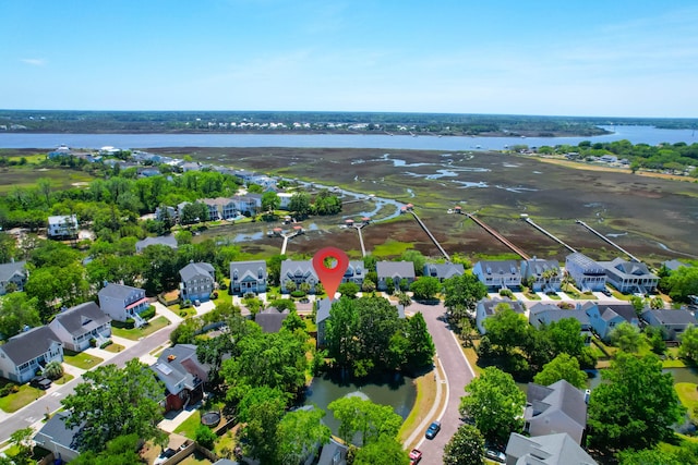drone / aerial view with a water view and a residential view