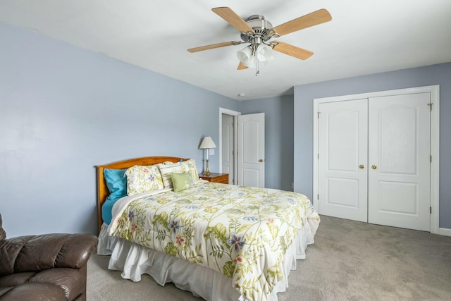 carpeted bedroom with a closet and a ceiling fan