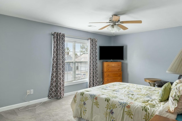 bedroom with visible vents, a ceiling fan, baseboards, and carpet floors