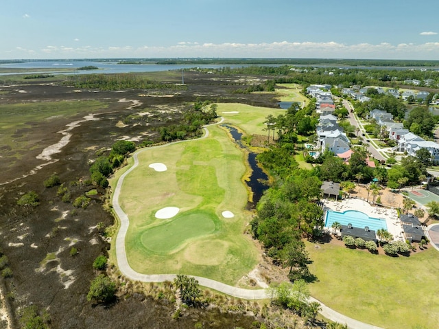 aerial view with a water view and view of golf course