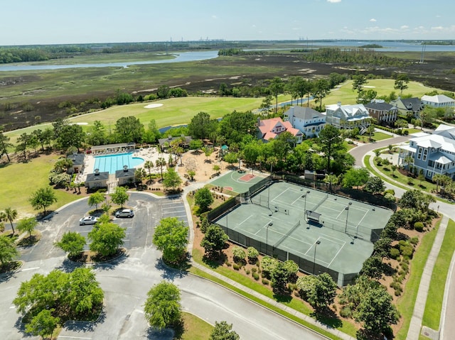 drone / aerial view featuring a water view and view of golf course