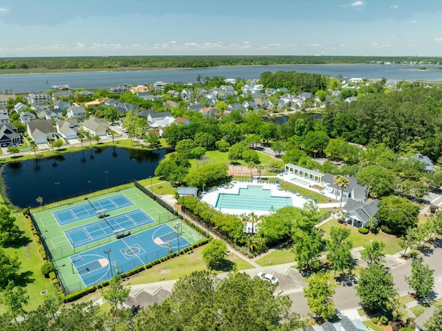 drone / aerial view with a residential view and a water view