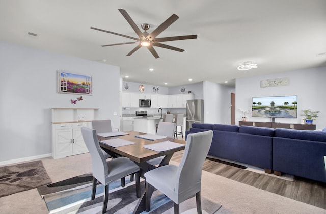 dining space with recessed lighting, ceiling fan, and baseboards