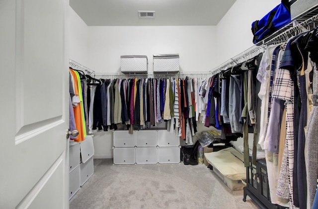 spacious closet with carpet flooring and visible vents