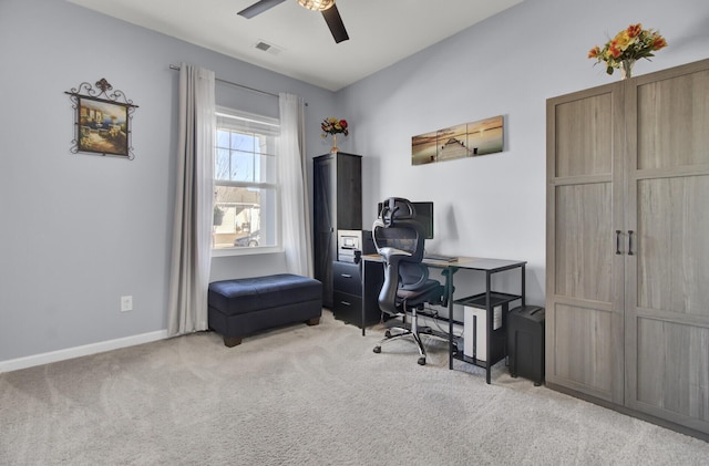 office area with carpet floors, baseboards, visible vents, and a ceiling fan