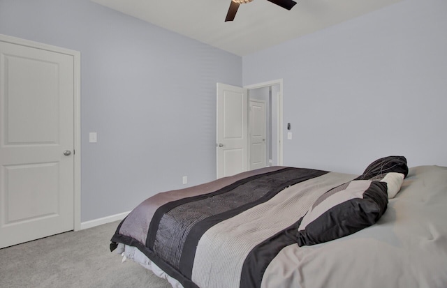 bedroom with carpet floors, baseboards, and a ceiling fan