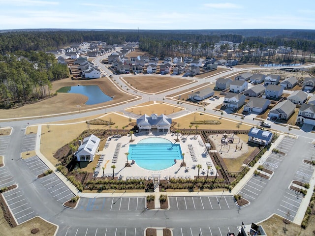 birds eye view of property featuring a water view and a residential view