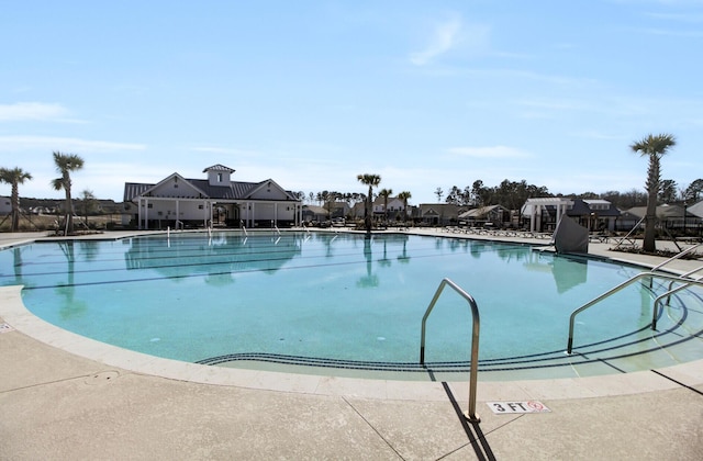 community pool featuring a patio area