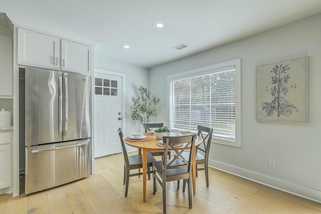 dining room with light hardwood / wood-style flooring