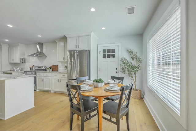 dining room with light wood-type flooring