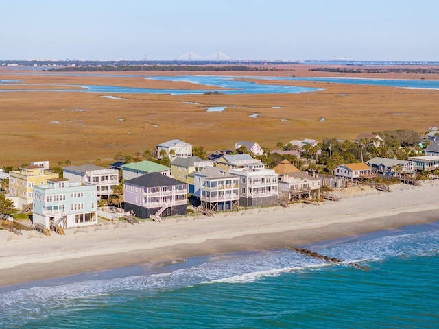 bird's eye view featuring a view of the beach and a water view