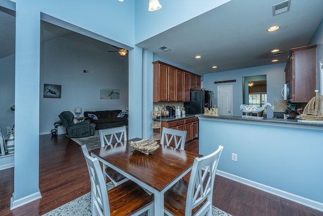 dining room featuring dark wood-type flooring and ceiling fan