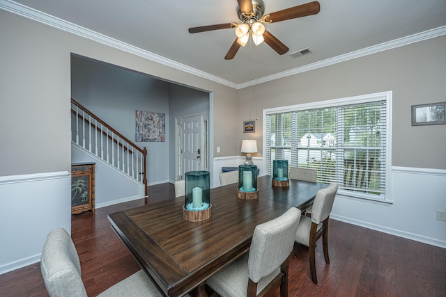 dining space with dark wood-type flooring, ceiling fan, and ornamental molding