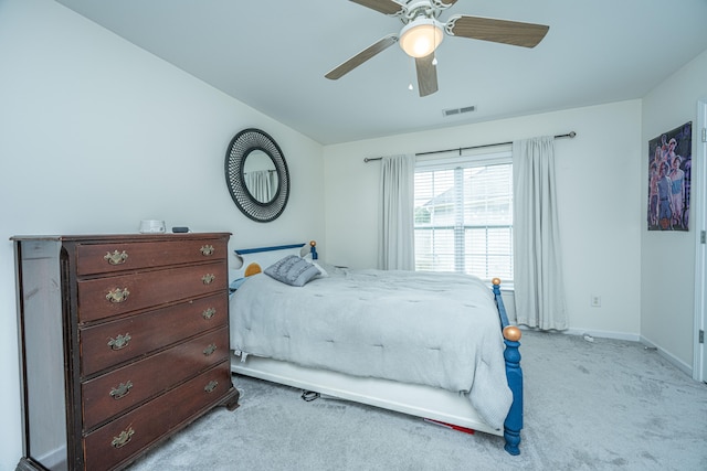 bedroom featuring light carpet and ceiling fan