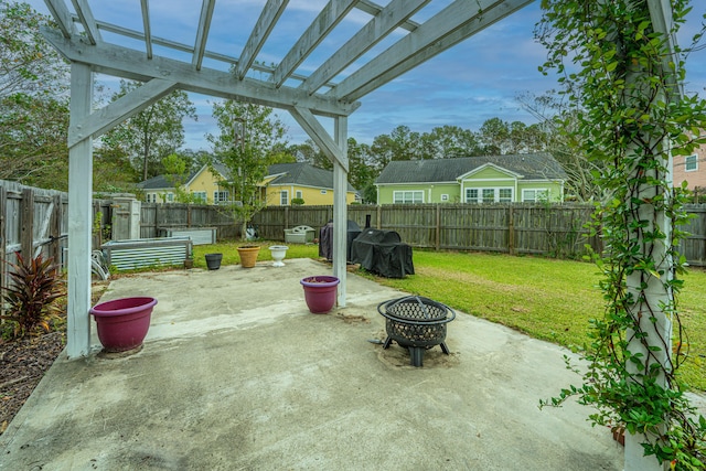 view of patio / terrace with a pergola and a fire pit