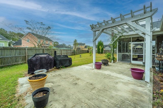 view of patio / terrace with ceiling fan, area for grilling, and a pergola