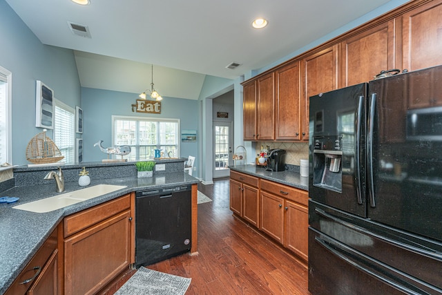 kitchen with dark hardwood / wood-style flooring, lofted ceiling, decorative backsplash, black appliances, and sink