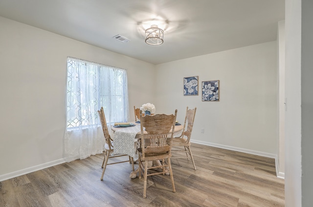 dining room featuring wood-type flooring