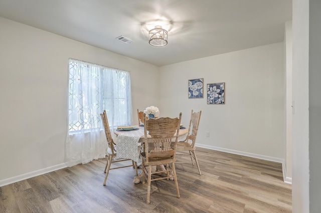 202 Greenmeadow Dr, Goose Creek, SC 29445 - dining room with baseboards, wood finished floors, and visible vents