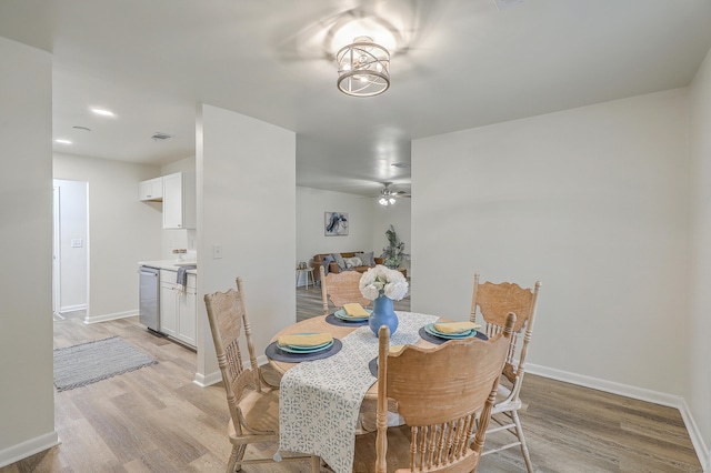 dining area with ceiling fan and light wood-type flooring