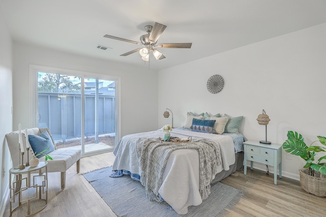 bedroom with ceiling fan, light hardwood / wood-style flooring, and access to exterior