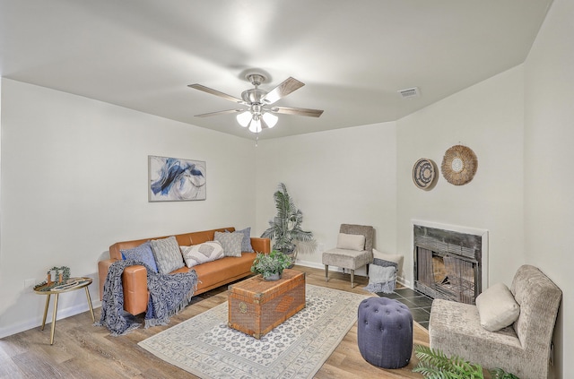 202 Greenmeadow Dr, Goose Creek, SC 29445 - living room featuring visible vents, a ceiling fan, wood finished floors, and a fireplace with flush hearth