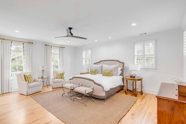 bedroom with light wood-type flooring and ceiling fan