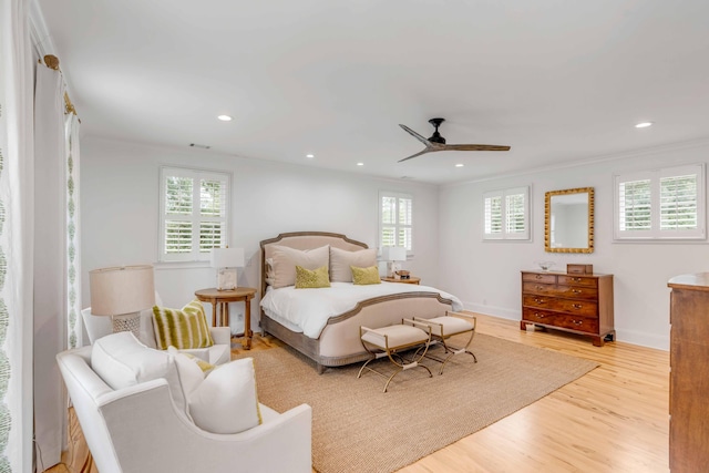 bedroom with ceiling fan, light hardwood / wood-style flooring, and ornamental molding