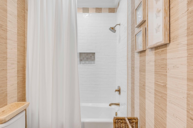 bathroom with toilet and shower / tub combo with curtain