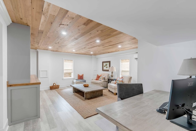 living room featuring a wall unit AC, wood ceiling, and light wood-type flooring