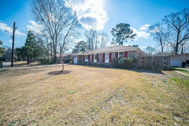 ranch-style home featuring a front yard