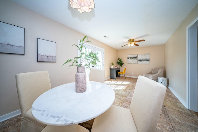 dining area with ceiling fan