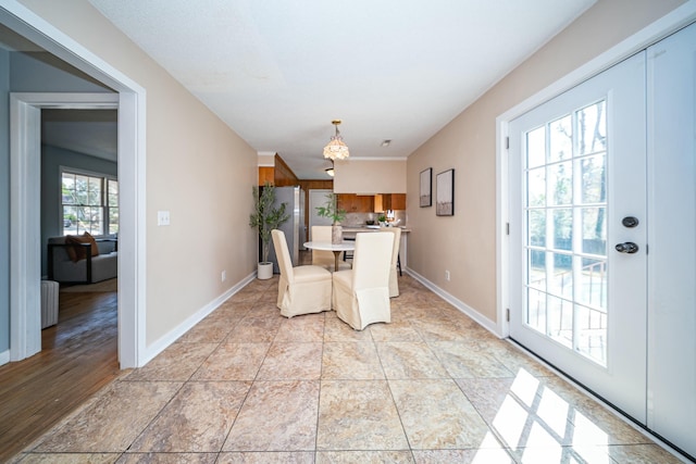 tiled dining room featuring radiator