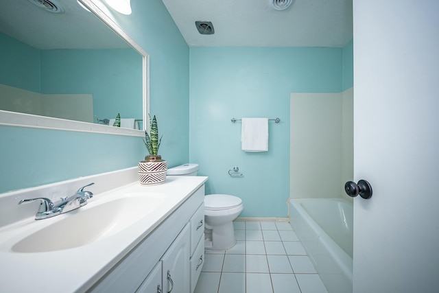 bathroom with vanity, tile patterned flooring, and toilet