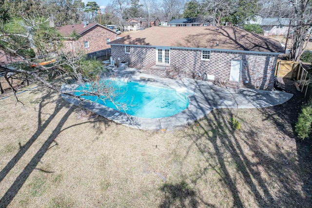 view of pool with a patio and french doors