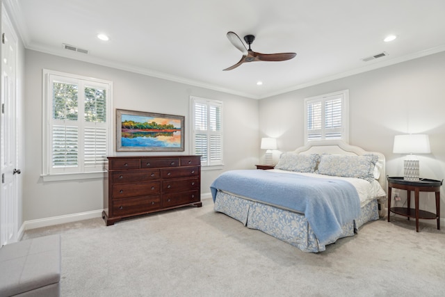 bedroom with crown molding, ceiling fan, and light carpet