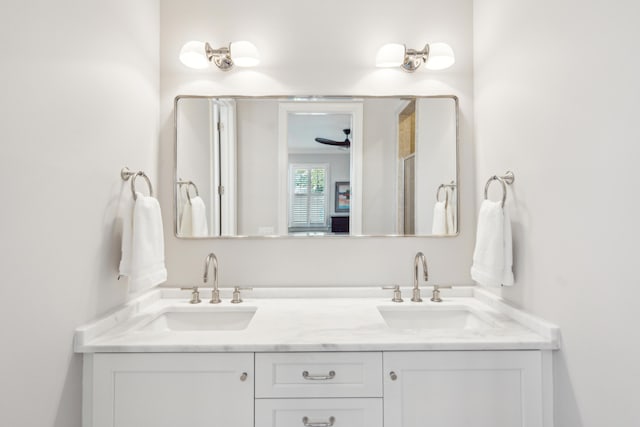 bathroom with ceiling fan and vanity